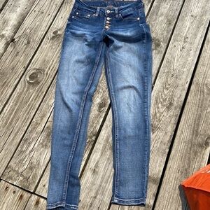 Indigo Rein button-fly jeans sport copper buttons, and copper rivets. Skinny.
